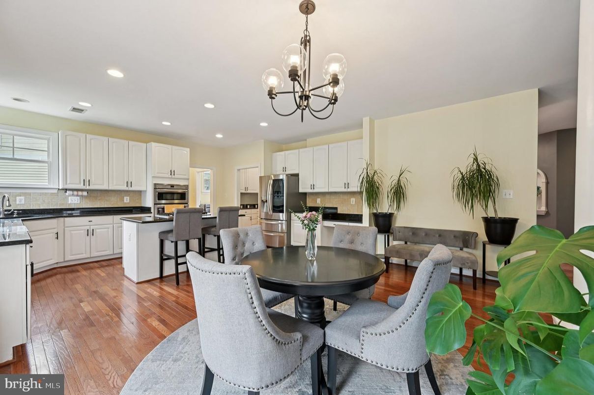 Chandelier, Dining room, Interior, Kitchen, Pendant Lights, Recessed Lighting, Stainless Steel Appliances, Wood Texture Flooring
