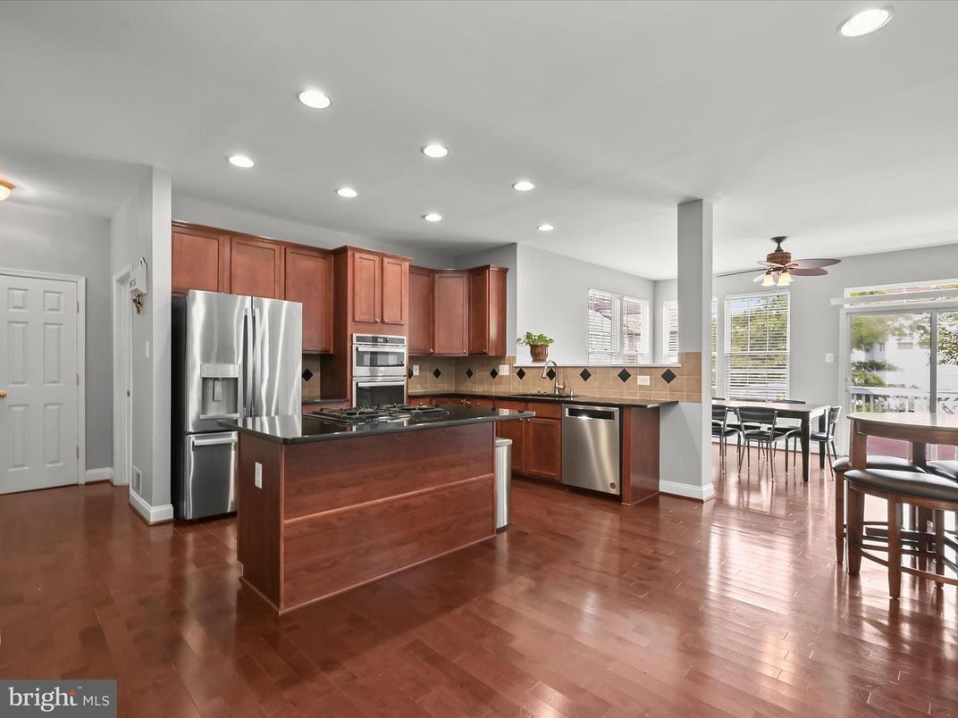 Dining room, Interior, Kitchen, Recessed Lighting, Stainless Steel Appliances, Wood Texture Flooring