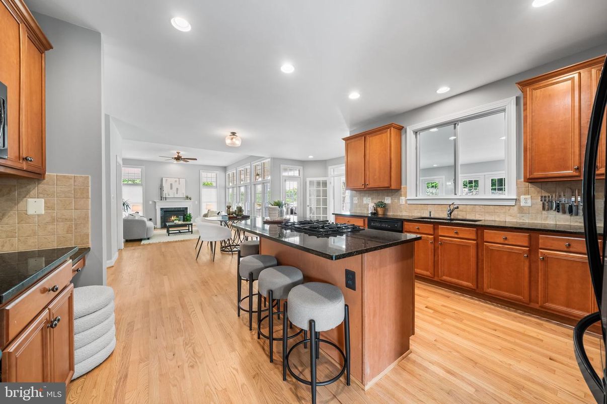 Dining room, Fireplace, Interior, Kitchen, Recessed Lighting, Wood Texture Flooring