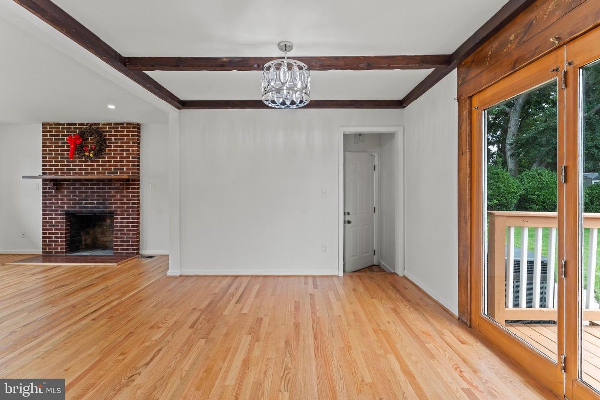 Empty room, Fireplace, Interior, Recessed Lighting, Stone Walls, Wooden Beams, Wood Texture Flooring