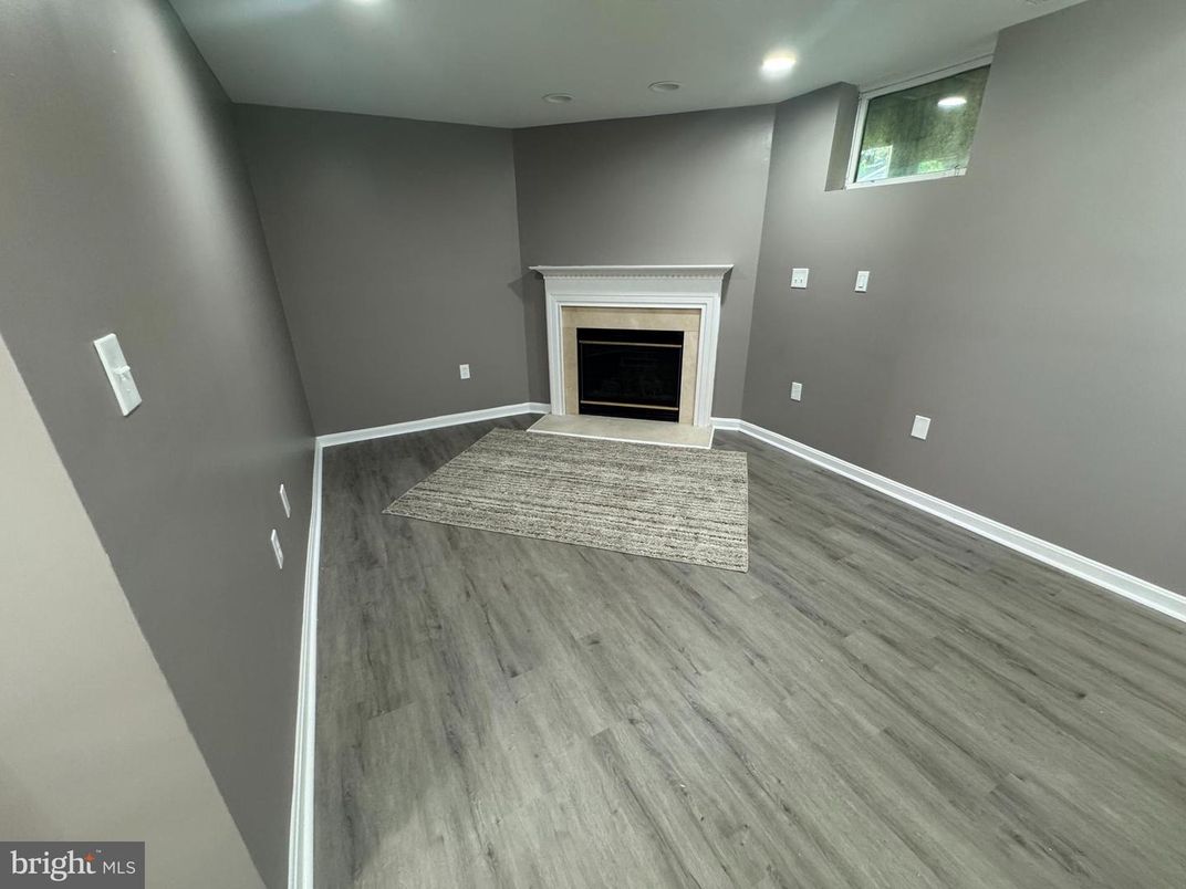 Empty room, Fireplace, Interior, Recessed Lighting, Wood Texture Flooring