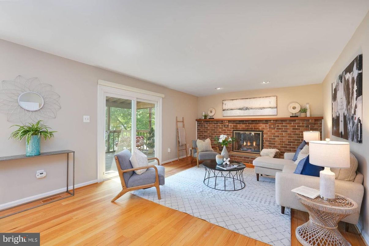Fireplace, Interior, Living room, Recessed Lighting, Stone Walls, Wood Texture Flooring