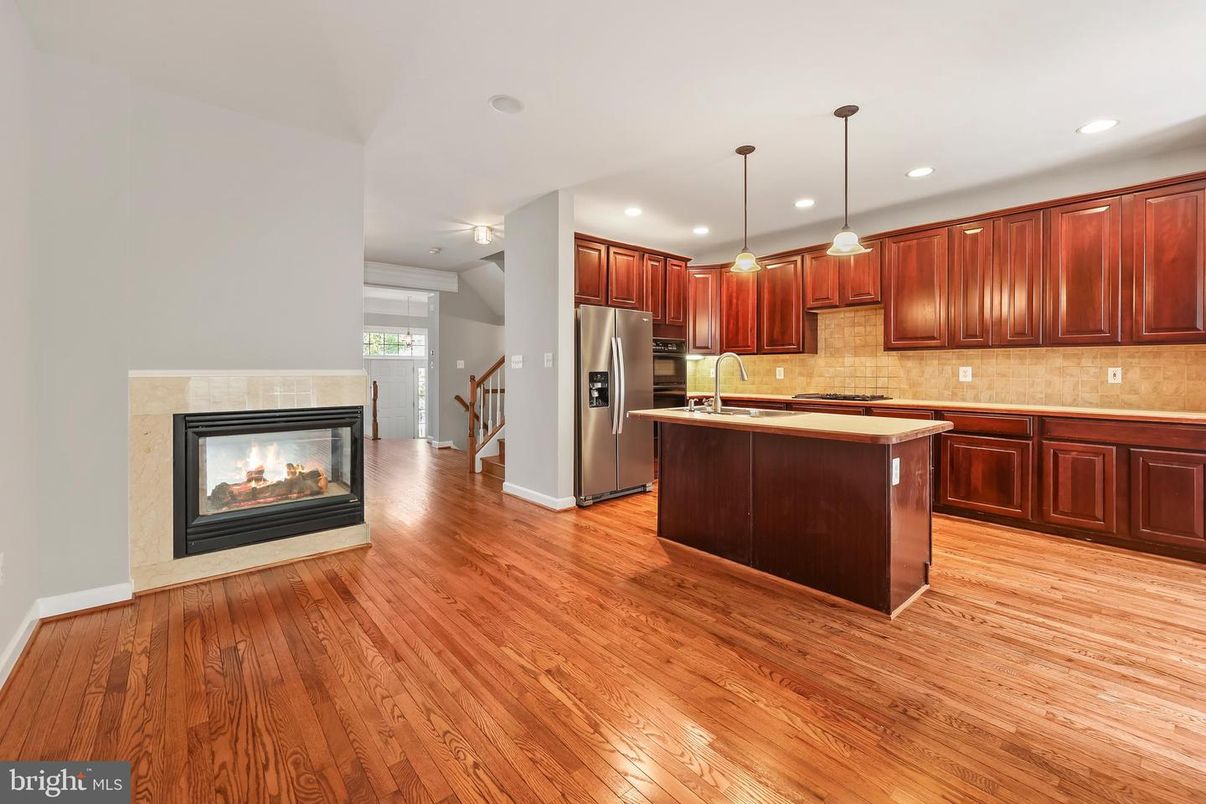 Fireplace, Interior, Kitchen, Pendant Lights, Recessed Lighting, Stainless Steel Appliances, Wood Texture Flooring