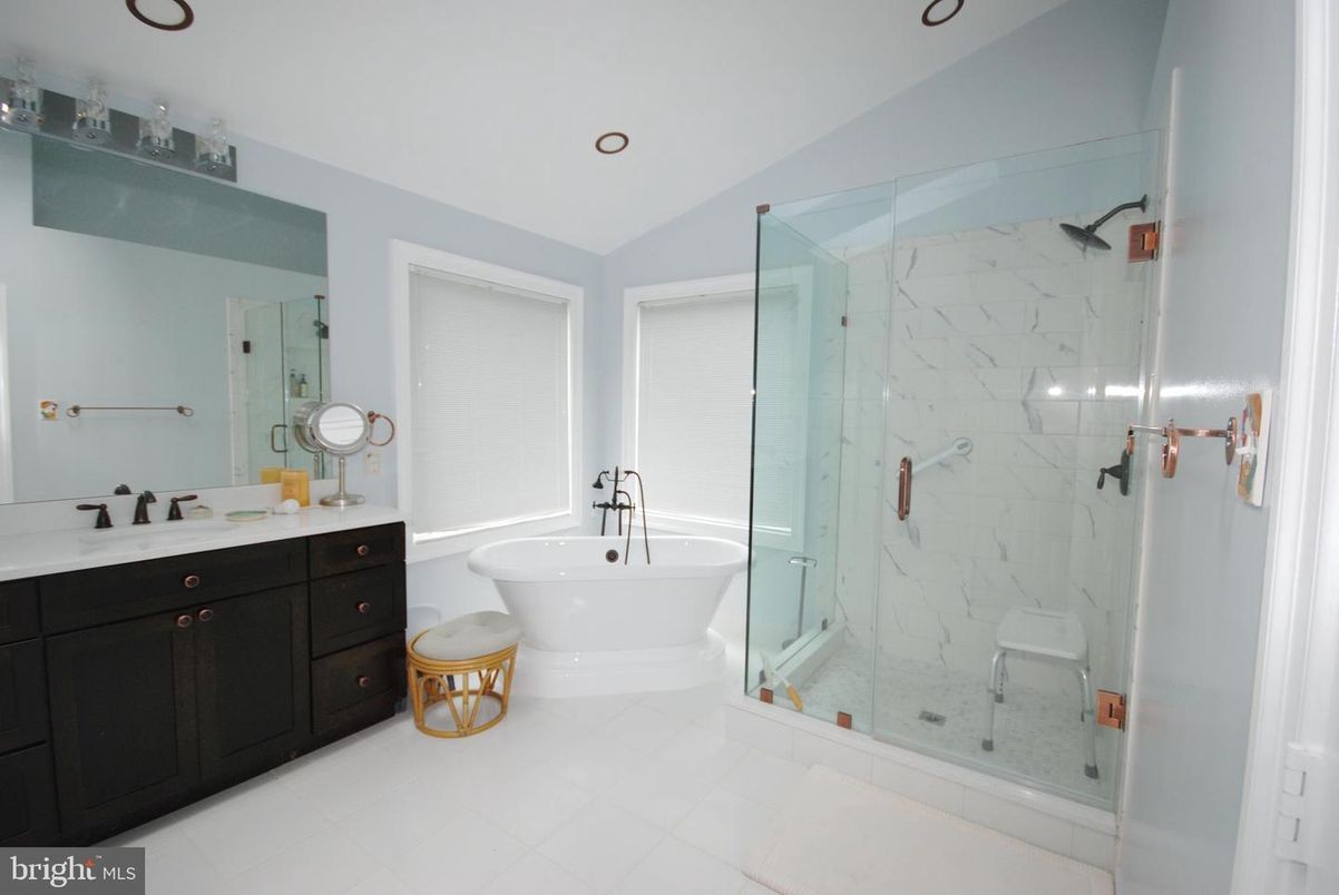 Bathroom, Dual Sink Vanities, Free Standing Baths, Glass Shower, Interior, Marble Walls, Recessed Lighting