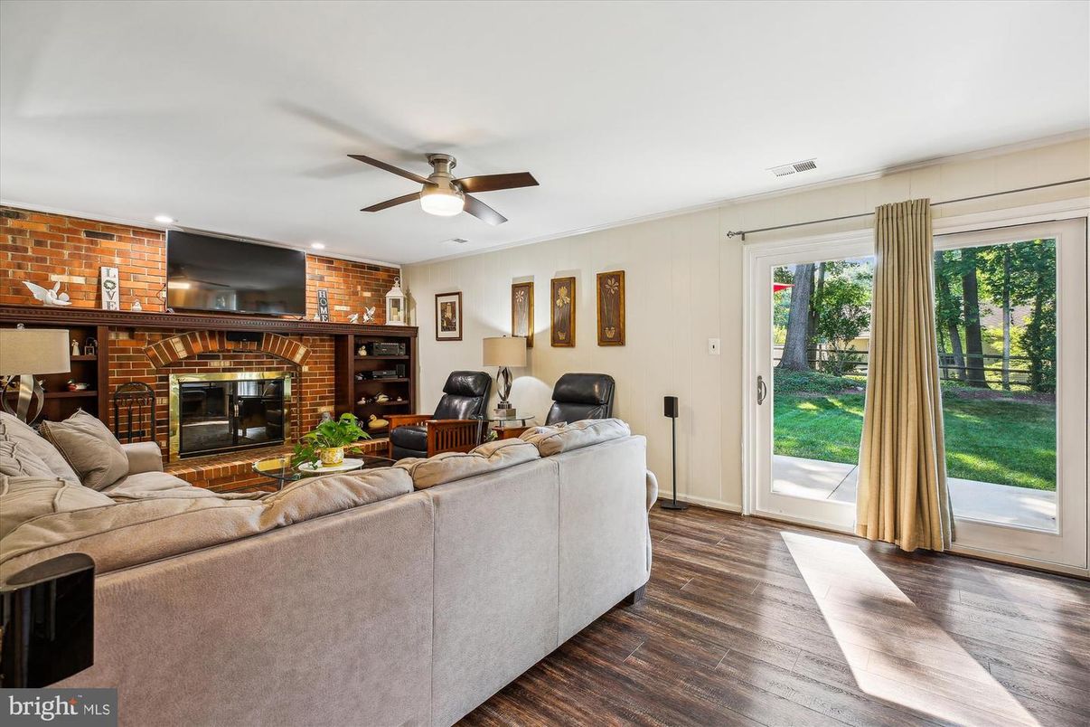 Fireplace, Interior, Living room, Recessed Lighting, Stone Walls, Wood Texture Flooring