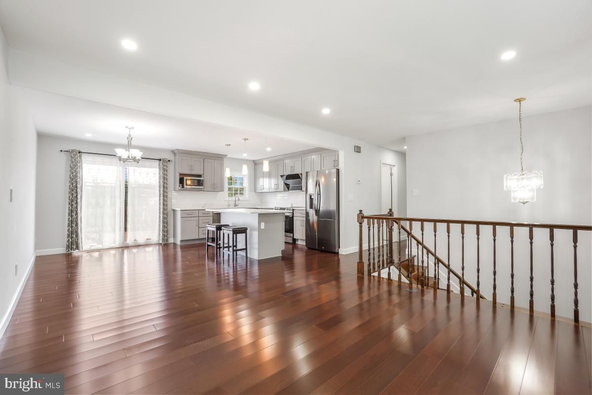Chandelier, Interior, Kitchen, Pendant Lights, Recessed Lighting, Stainless Steel Appliances, Wood Texture Flooring