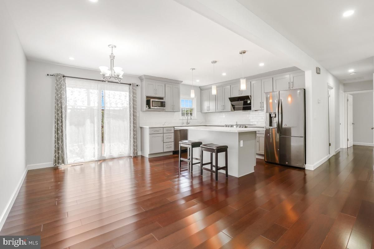 Chandelier, Interior, Kitchen, Pendant Lights, Recessed Lighting, Stainless Steel Appliances, Wood Texture Flooring