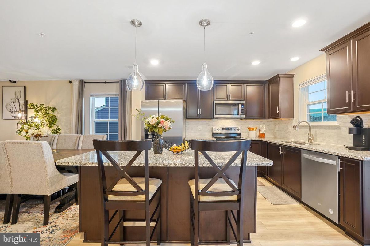 Dining room, Interior, Kitchen, Pendant Lights, Recessed Lighting, Stainless Steel Appliances, Wood Texture Flooring