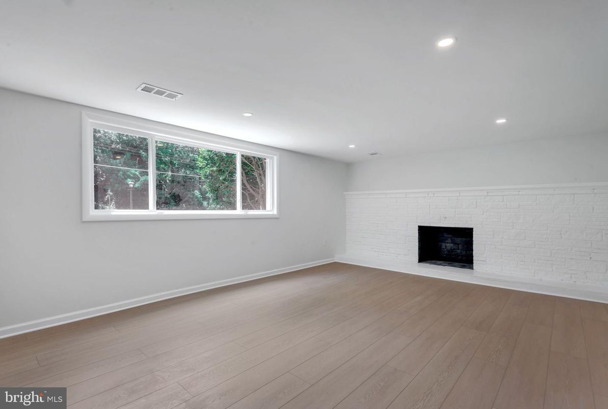 Empty room, Fireplace, Interior, Recessed Lighting, Stone Walls, Wood Texture Flooring