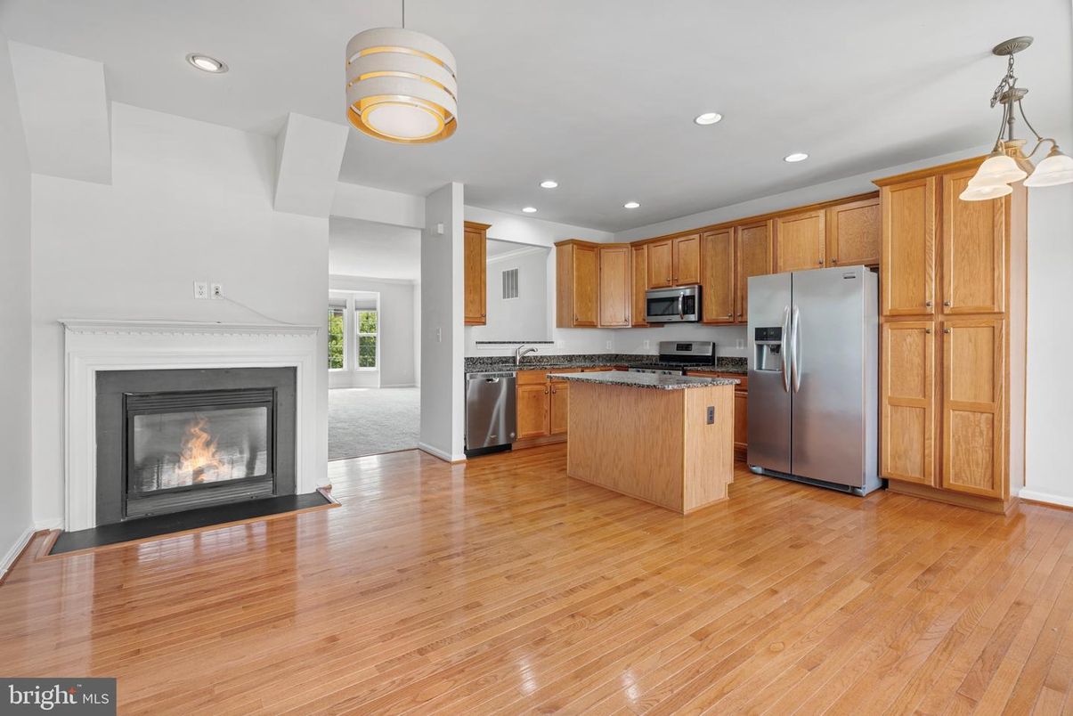 Fireplace, Interior, Kitchen, Pendant Lights, Recessed Lighting, Stainless Steel Appliances, Wood Texture Flooring