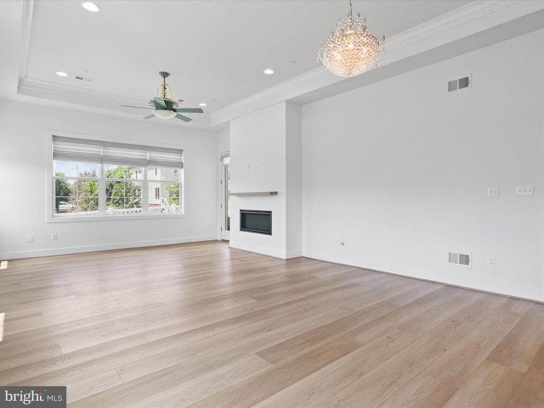Chandelier, Empty room, Fireplace, Interior, Recessed Lighting, Wood Texture Flooring