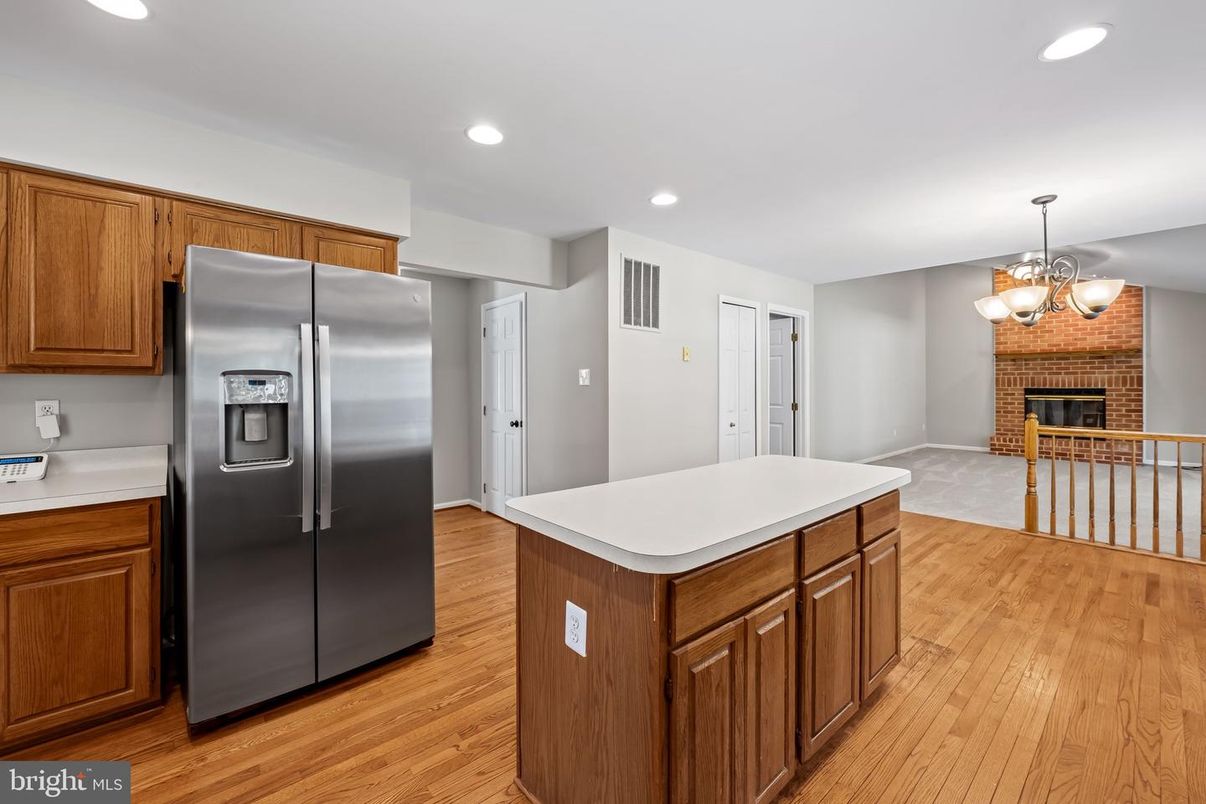 Chandelier, Fireplace, Interior, Kitchen, Recessed Lighting, Wood Texture Flooring