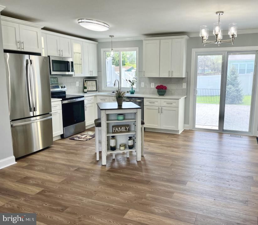 Chandelier, Interior, Kitchen, Pendant Lights, Stainless Steel Appliances, Wood Texture Flooring