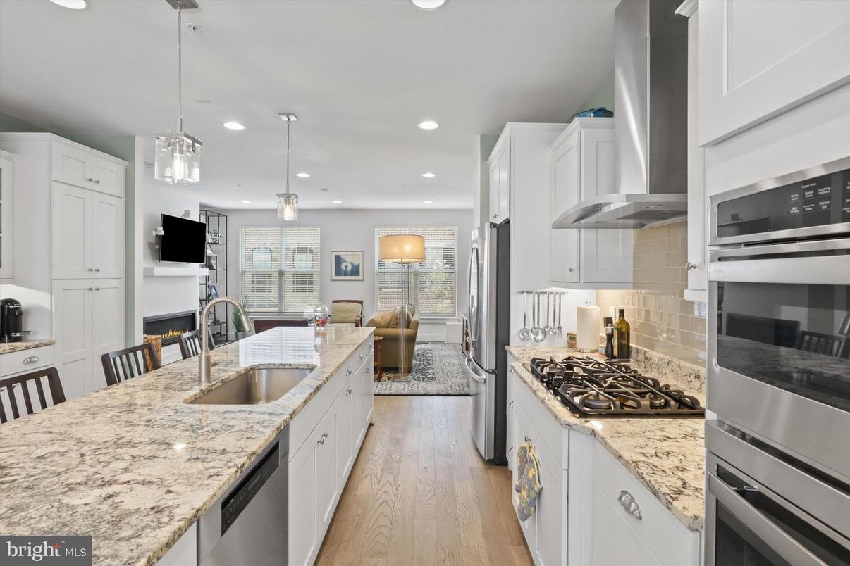 Dining room, Interior, Kitchen, Living room, Pendant Lights, Recessed Lighting, Stainless Steel Appliances, Wood Texture Flooring