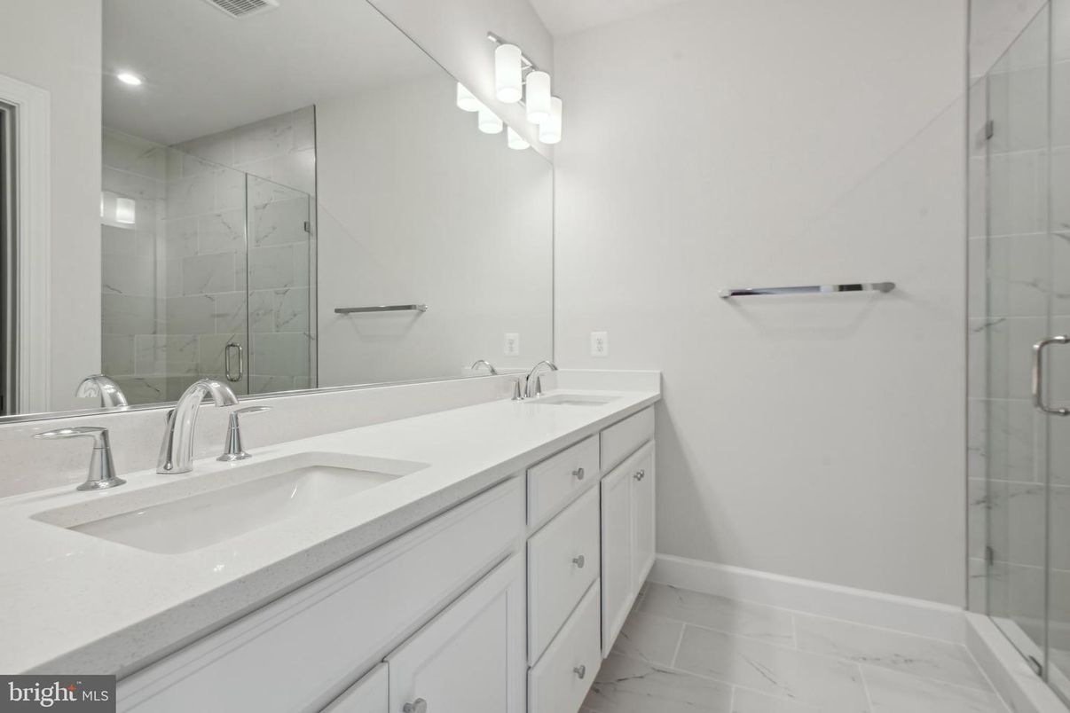 Bathroom, Dual Sink Vanities, Glass Shower, Interior, Marble, Marble Walls, Recessed Lighting