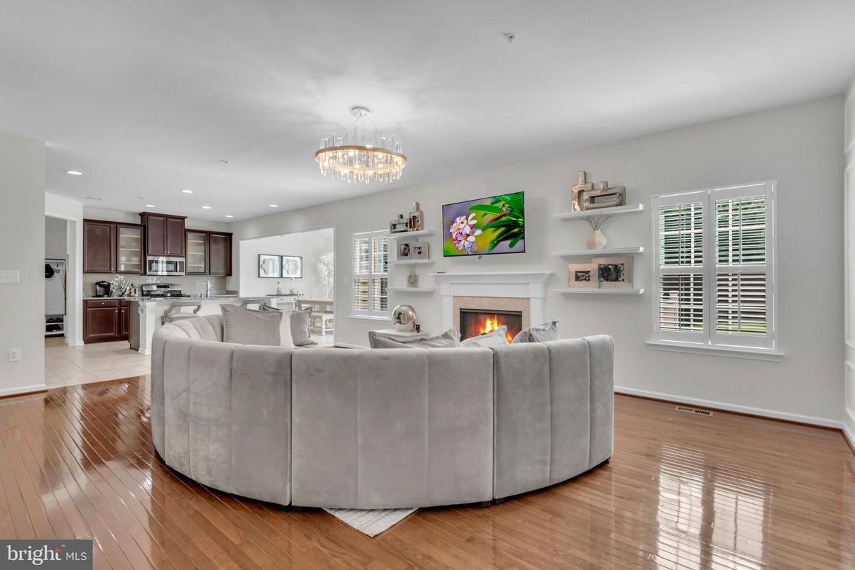 Chandelier, Fireplace, Interior, Kitchen, Living room, Recessed Lighting, Wood Texture Flooring