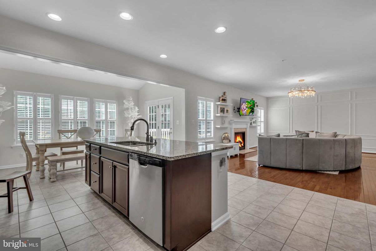 Chandelier, Dining room, Fireplace, Interior, Kitchen, Living room, Recessed Lighting, Wood Texture Flooring
