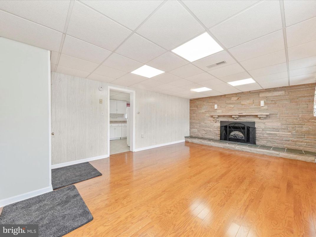 Empty room, Fireplace, Interior, Recessed Lighting, Stone Walls, Wood Texture Flooring, Wooden Walls