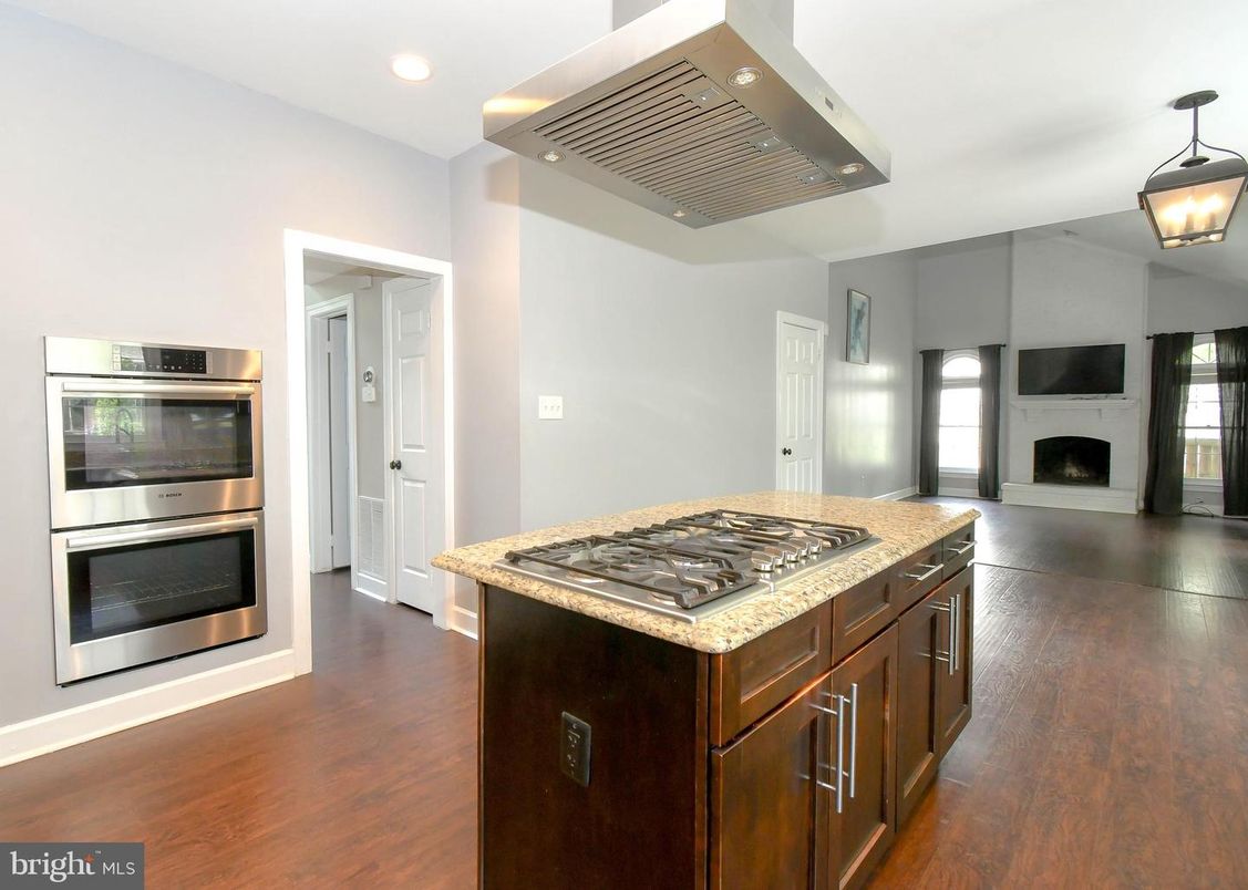 Fireplace, Interior, Kitchen, Pendant Lights, Recessed Lighting, Stainless Steel Appliances, Wood Texture Flooring