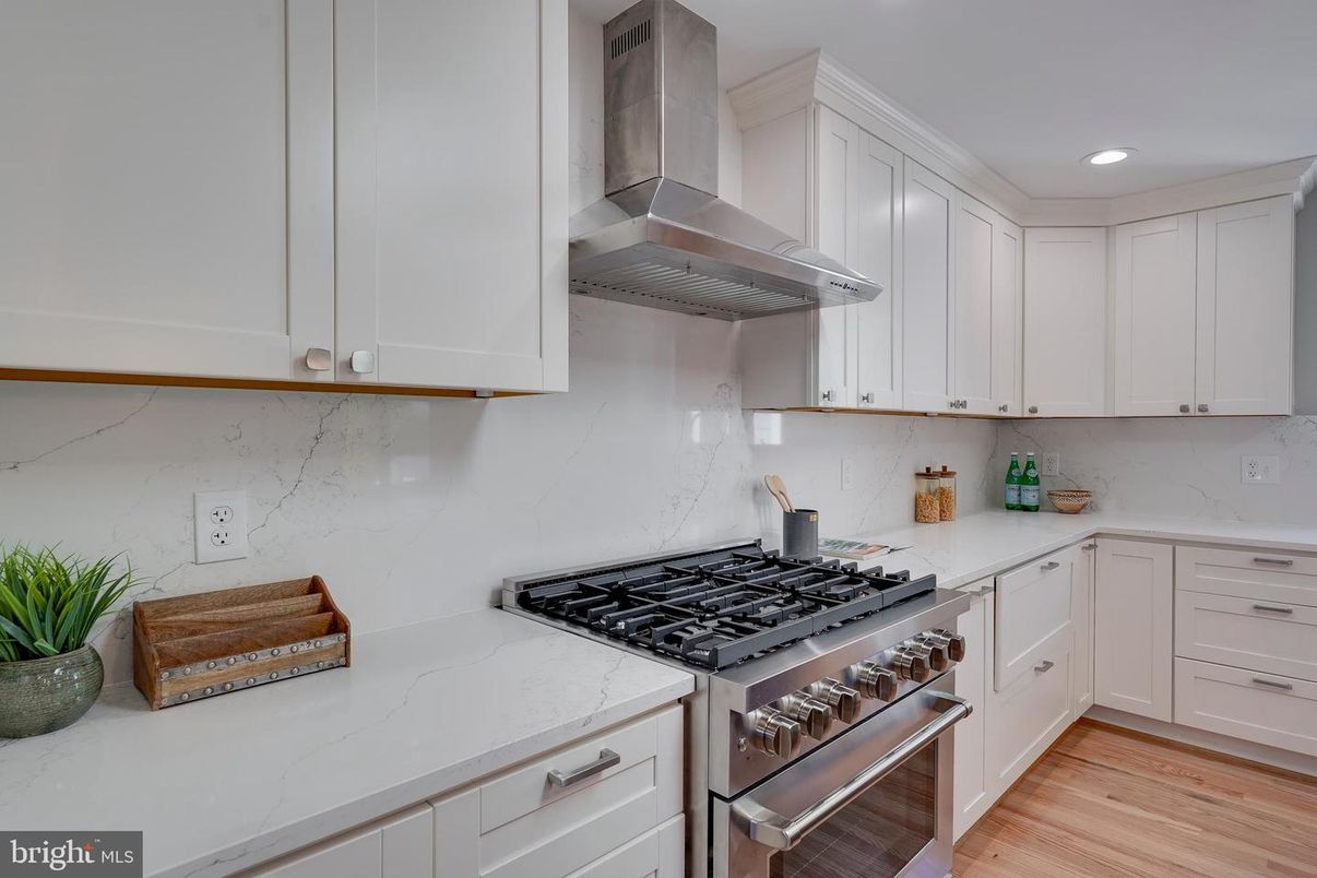 Interior, Kitchen, Marble Walls, Recessed Lighting, Stainless Steel Appliances, Wood Texture Flooring