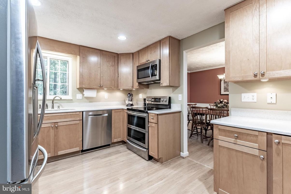Dining room, Interior, Kitchen, Recessed Lighting, Stainless Steel Appliances, Wood Texture Flooring