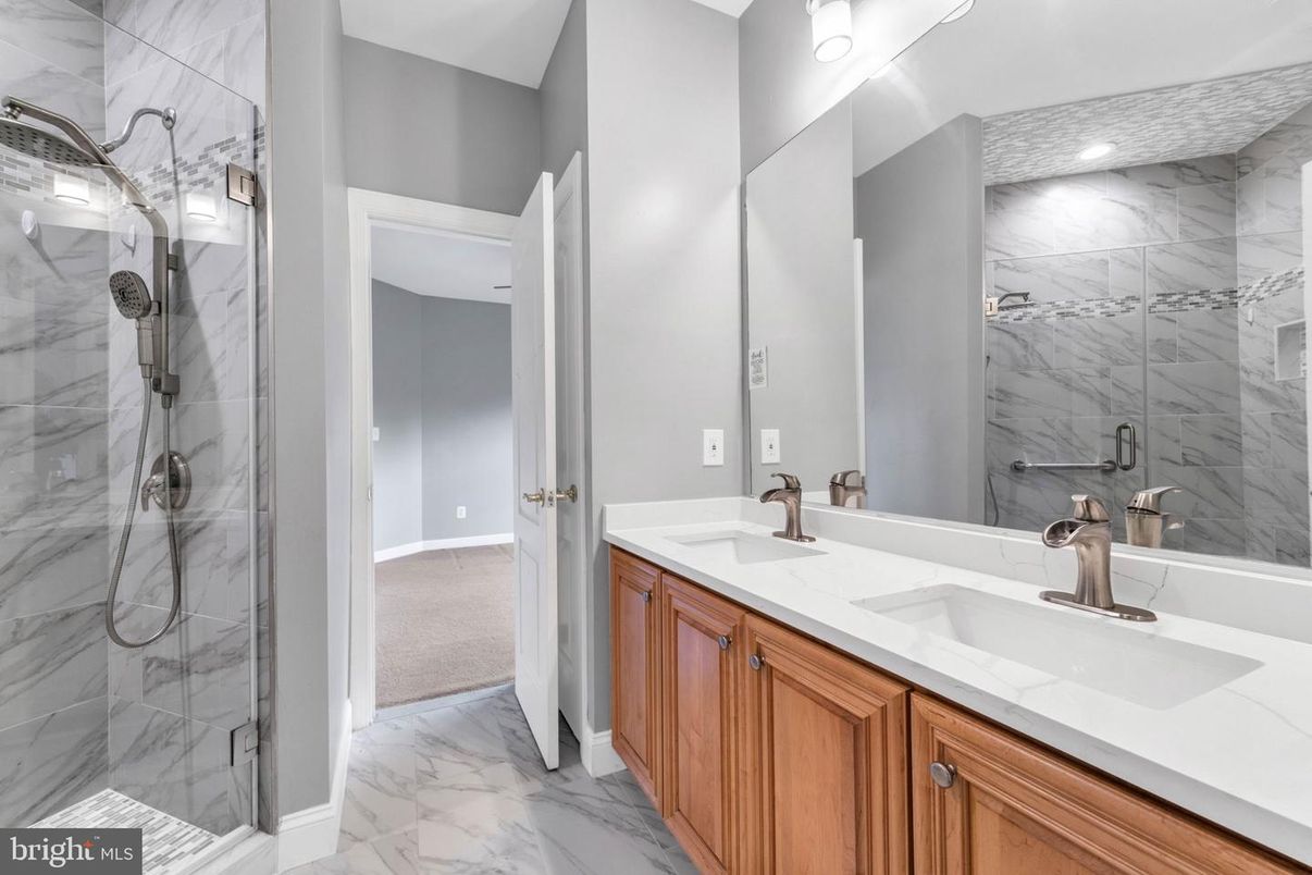 Bathroom, Dual Sink Vanities, Glass Shower, Interior, Marble, Marble Walls, Recessed Lighting