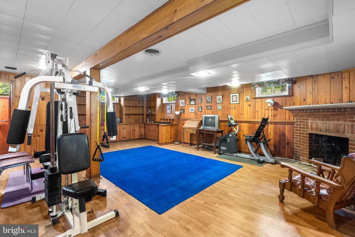 Fireplace, Fitness Equipment, Interior, Wood Texture Flooring, Wooden Walls