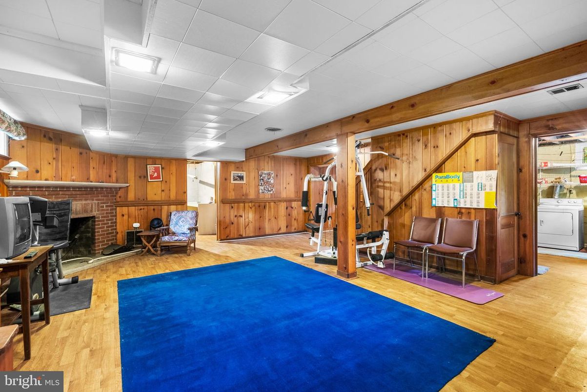 Fireplace, Fitness Equipment, Interior, Recessed Lighting, Wood Texture Flooring, Wooden Walls