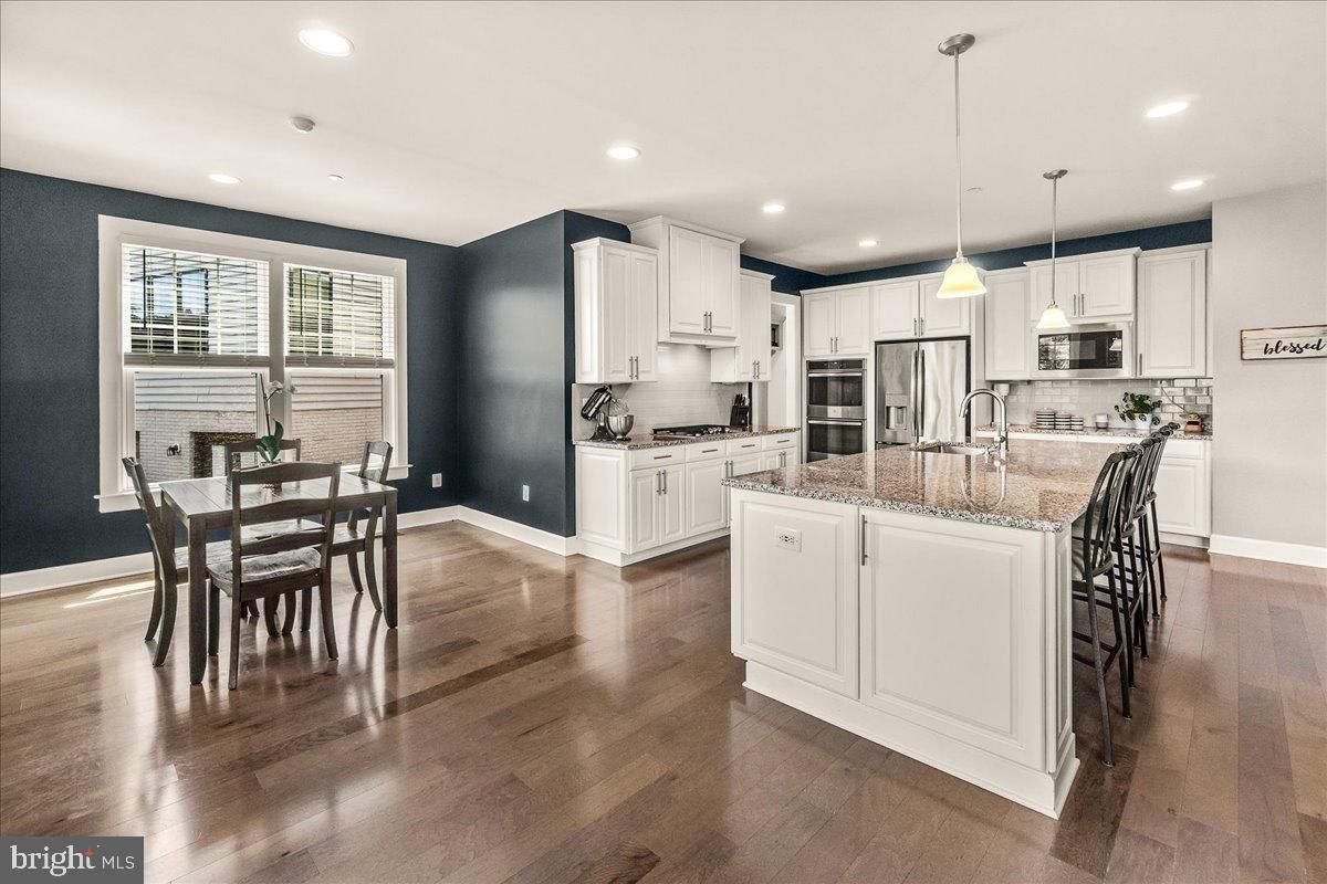 Dining room, Interior, Kitchen, Pendant Lights, Recessed Lighting, Stainless Steel Appliances, Wood Texture Flooring