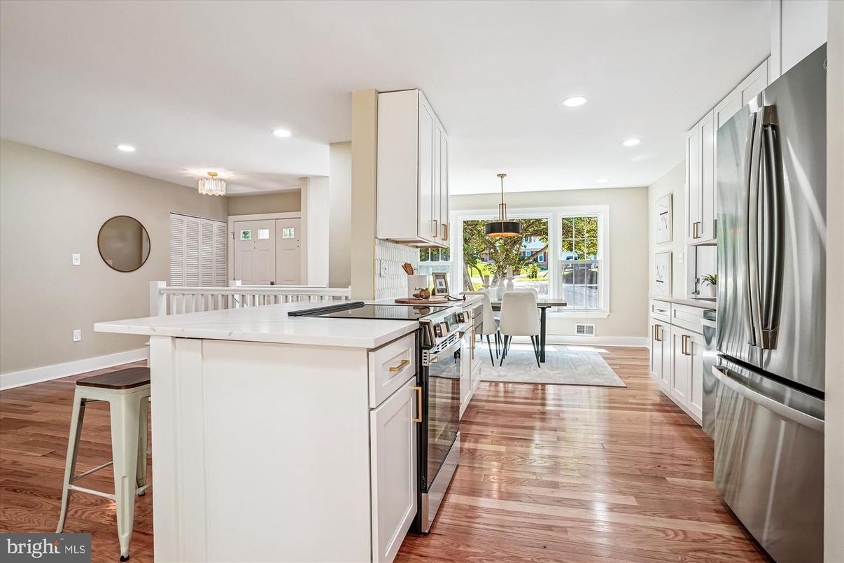 Dining room, Interior, Kitchen, Recessed Lighting, Stainless Steel Appliances, Wood Texture Flooring