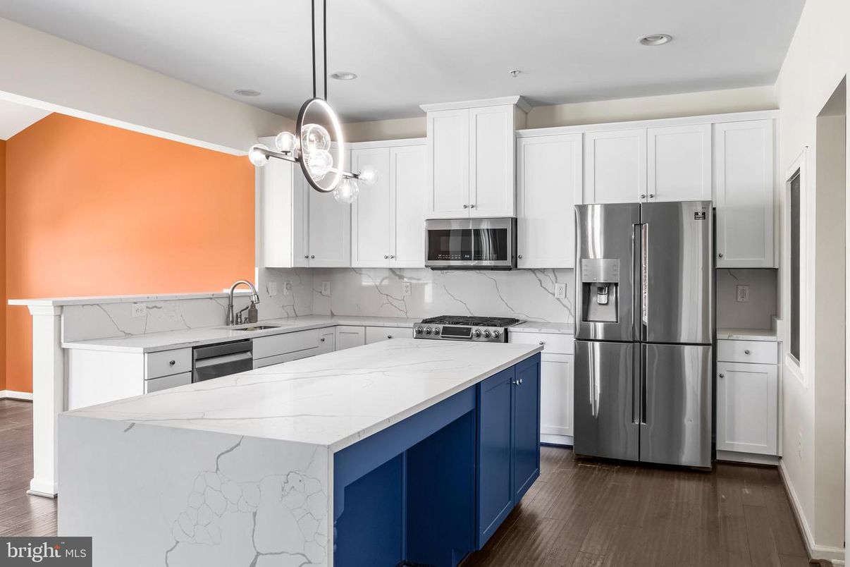 Interior, Kitchen, Marble Walls, Pendant Lights, Recessed Lighting, Stainless Steel Appliances, Wood Texture Flooring