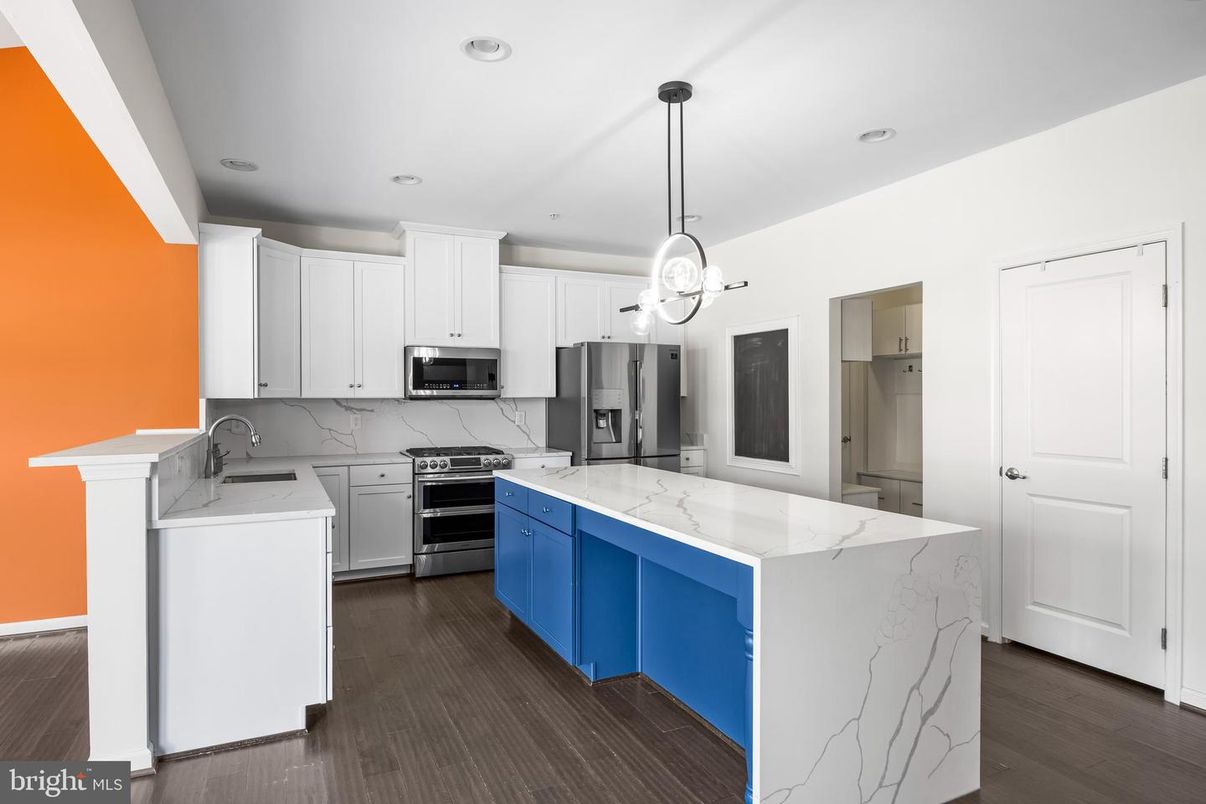 Interior, Kitchen, Marble Walls, Pendant Lights, Recessed Lighting, Stainless Steel Appliances, Wood Texture Flooring