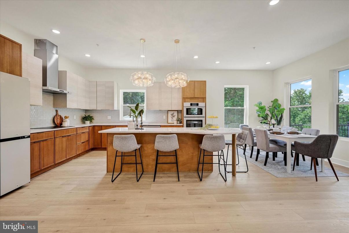 Dining room, Interior, Kitchen, Pendant Lights, Recessed Lighting, Stainless Steel Appliances, Wood Texture Flooring