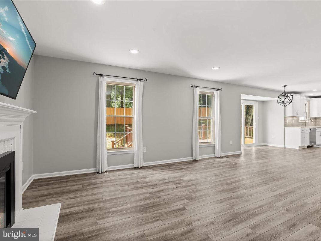 Empty room, Fireplace, Interior, Kitchen, Pendant Lights, Recessed Lighting, Wood Texture Flooring