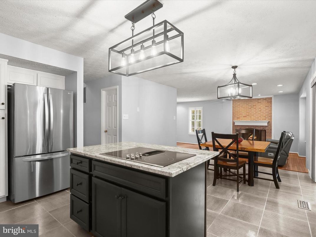 Dining room, Fireplace, Interior, Kitchen, Pendant Lights, Recessed Lighting, Stainless Steel Appliances, Stone Walls