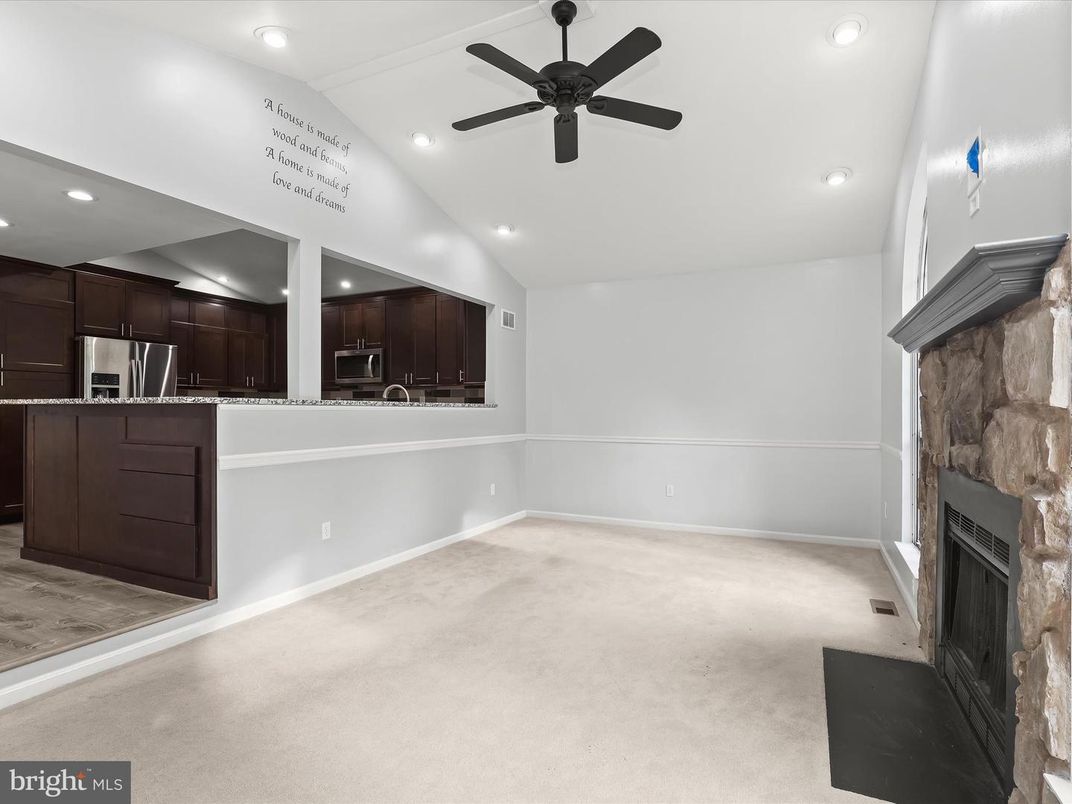 Empty room, Fireplace, Interior, Kitchen, Recessed Lighting, Stainless Steel Appliances