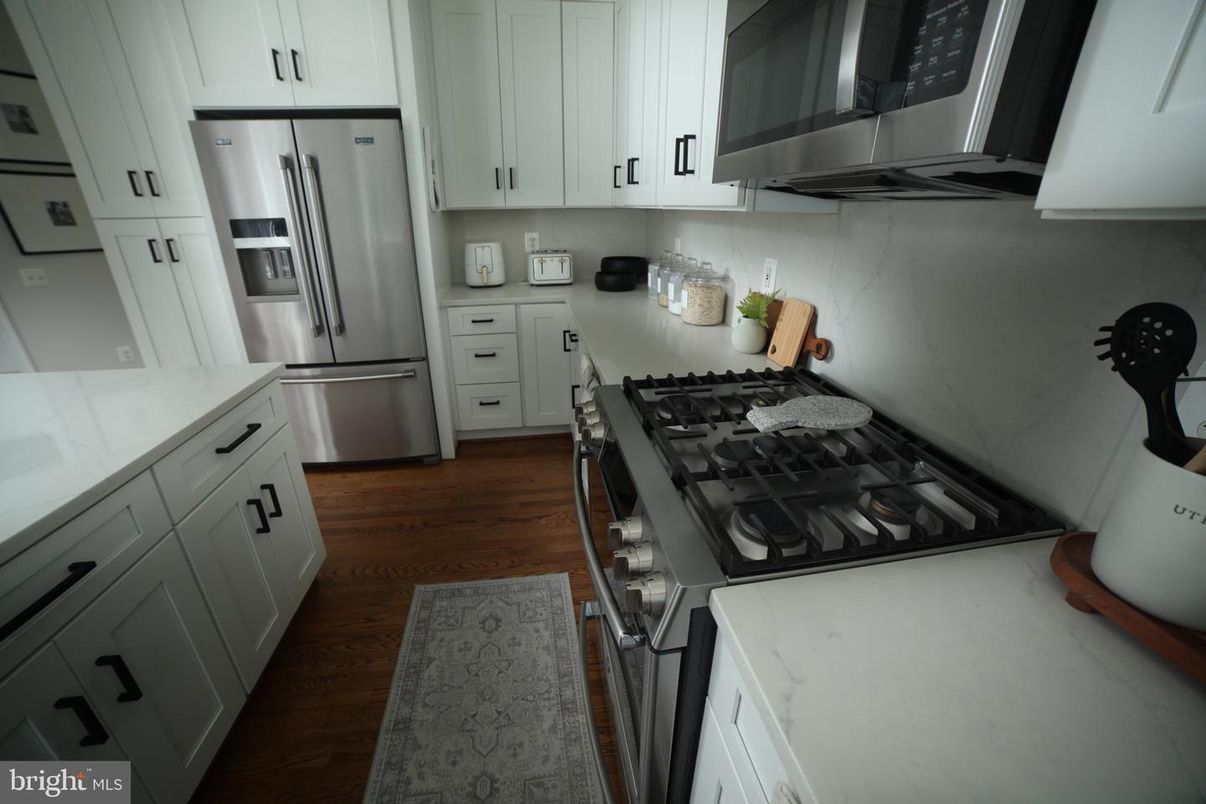 Interior, Kitchen, Marble Walls, Stainless Steel Appliances, Wood Texture Flooring