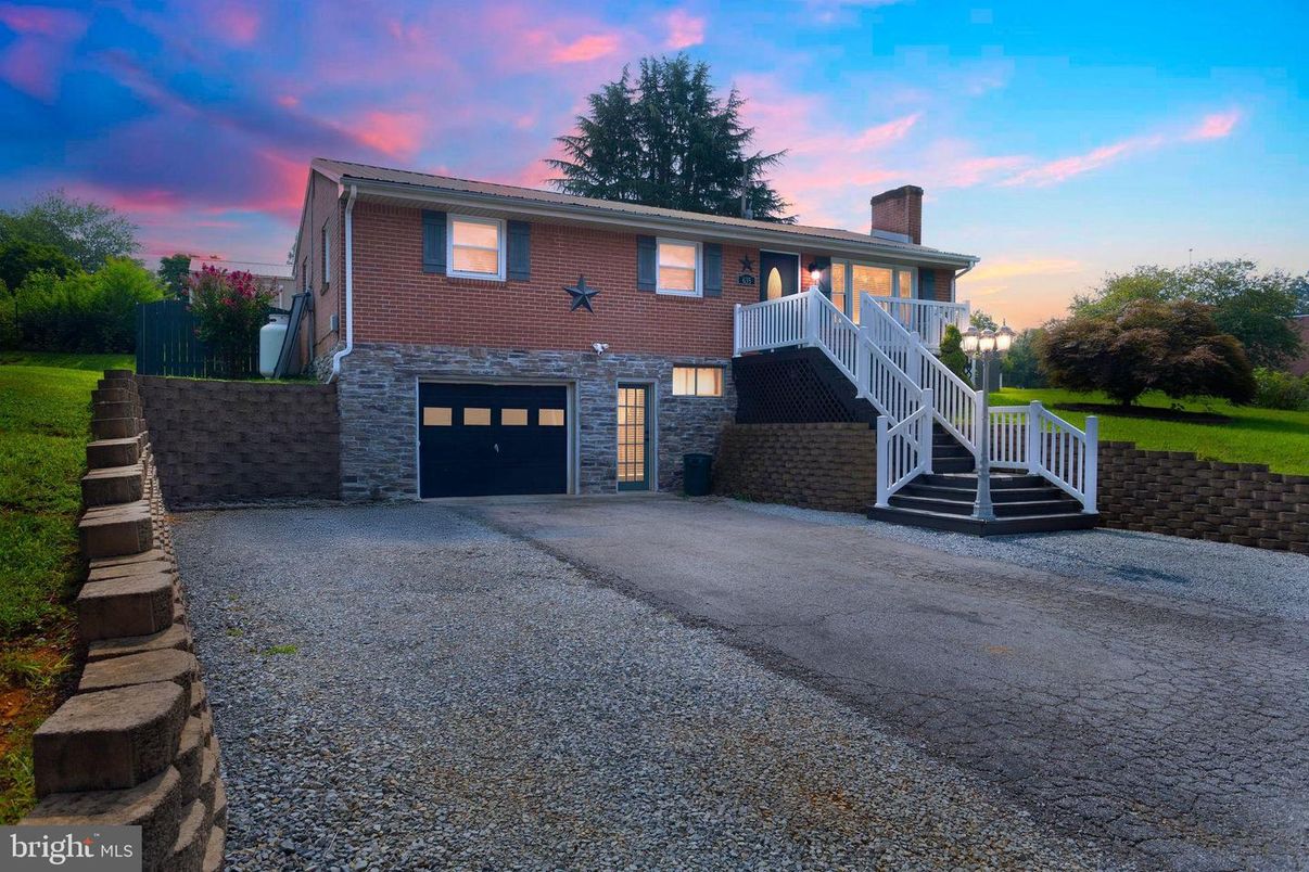 Attached, Backyard, Exterior, Facade, Brick Facade, Raised Ranch