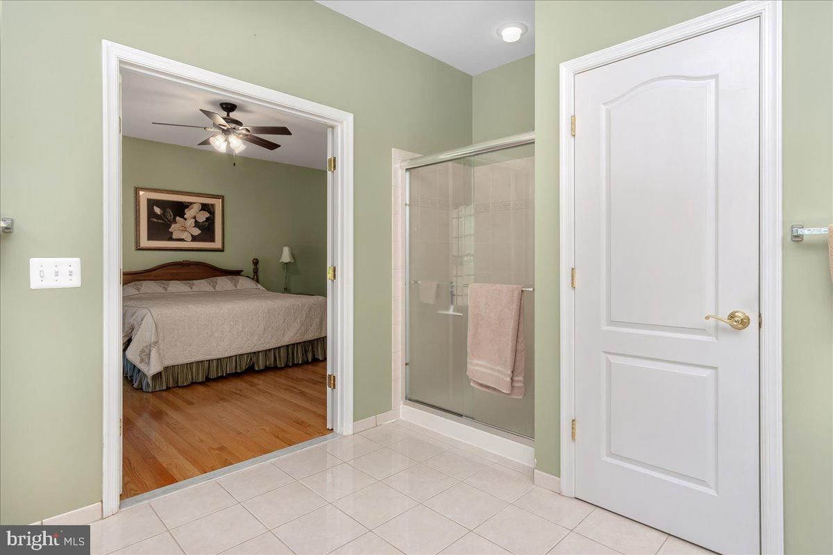 Bathroom, Bedroom, Glass Shower, Interior, Recessed Lighting, Wood Texture Flooring