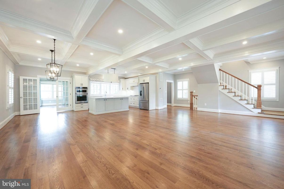 Chandelier, Empty room, Interior, Kitchen, Pendant Lights, Recessed Lighting, Stainless Steel Appliances, Wood Texture Flooring