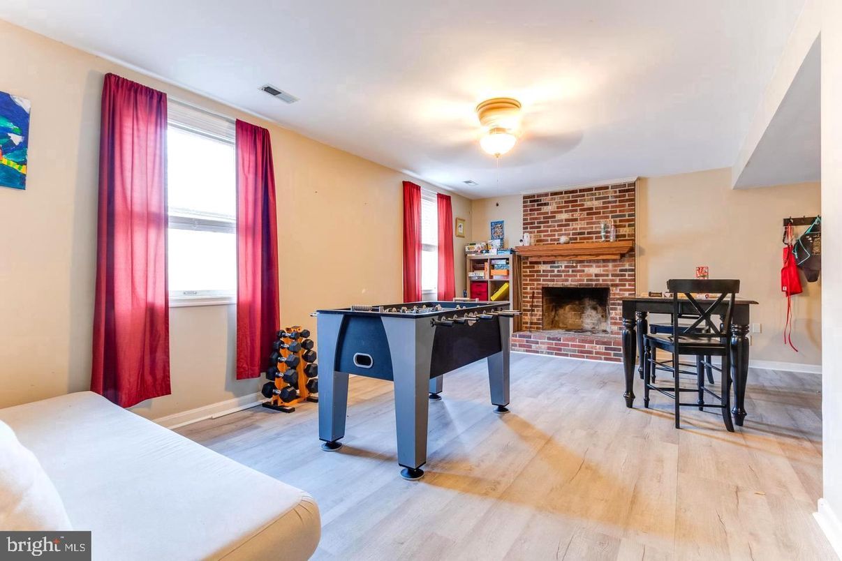 Fireplace, Game Room, Interior, Stone Walls, Wood Texture Flooring