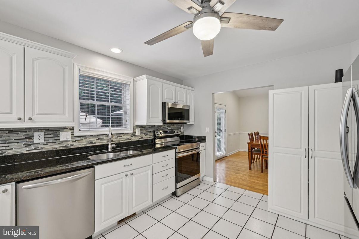 Dining room, Interior, Kitchen, Recessed Lighting, Stainless Steel Appliances, Wood Texture Flooring