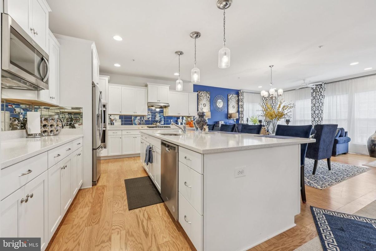 Dining room, Interior, Kitchen, Pendant Lights, Recessed Lighting, Stainless Steel Appliances, Wood Texture Flooring