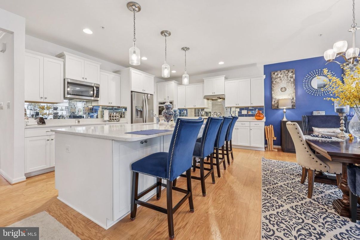 Dining room, Interior, Kitchen, Pendant Lights, Recessed Lighting, Stainless Steel Appliances, Wood Texture Flooring