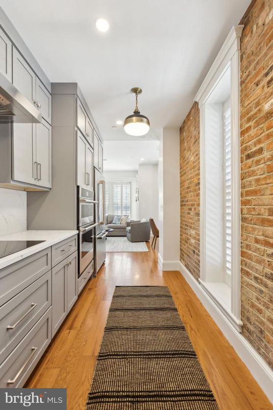 Interior, Kitchen, Recessed Lighting, Stainless Steel Appliances, Stone Walls, Wood Texture Flooring