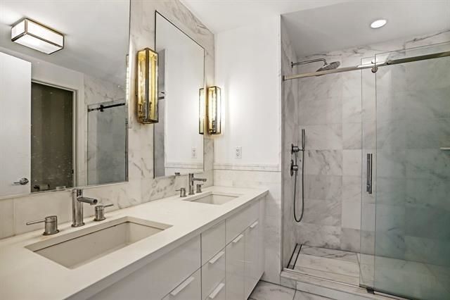 Bathroom, Dual Sink Vanities, Glass Shower, Interior, Marble, Marble Walls, Recessed Lighting