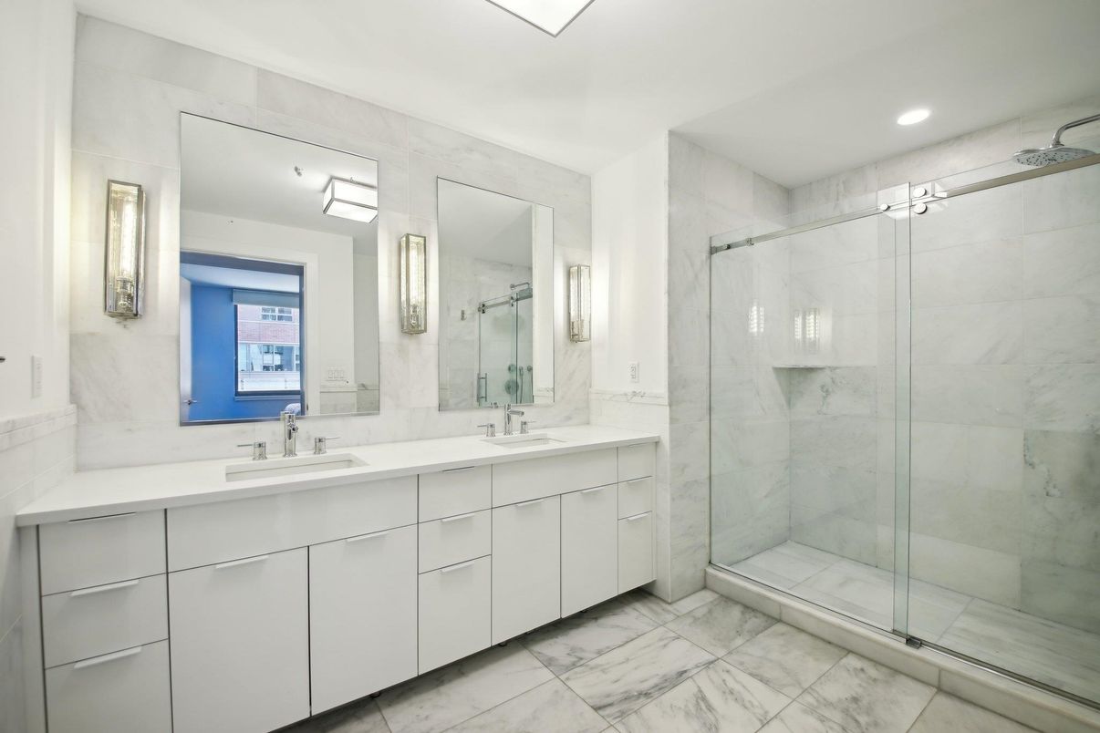 Bathroom, Dual Sink Vanities, Glass Shower, Interior, Marble, Marble Walls, Recessed Lighting