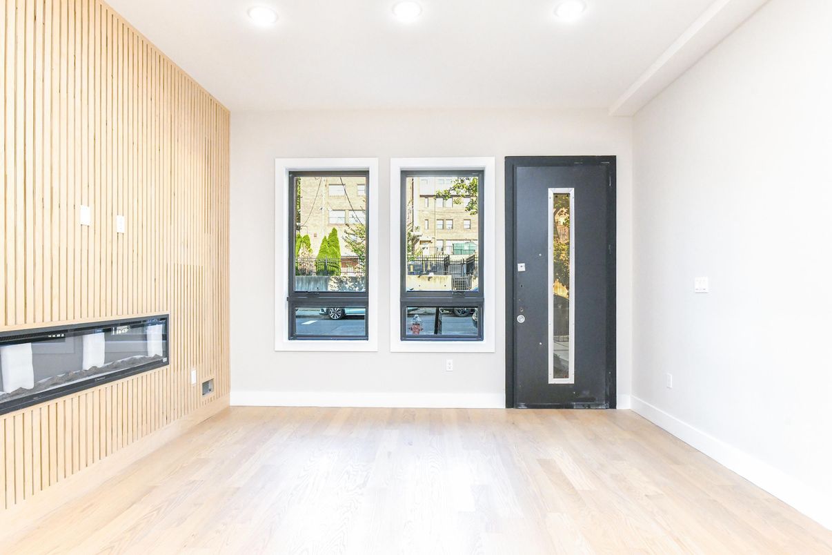 Empty room, Fireplace, Interior, Pendant Lights, Recessed Lighting, Wood Texture Flooring