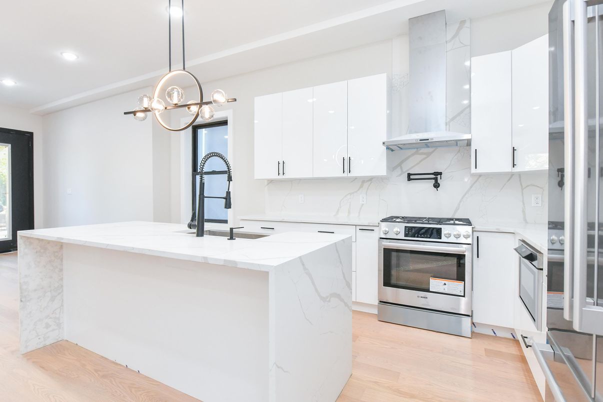 Interior, Kitchen, Marble Walls, Pendant Lights, Recessed Lighting, Stainless Steel Appliances, Wood Texture Flooring
