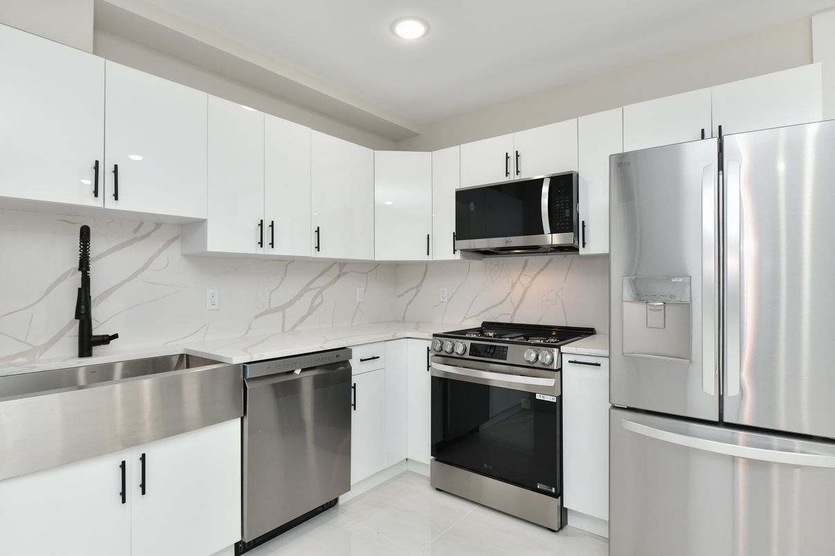 Interior, Kitchen, Marble Walls, Recessed Lighting, Stainless Steel Appliances